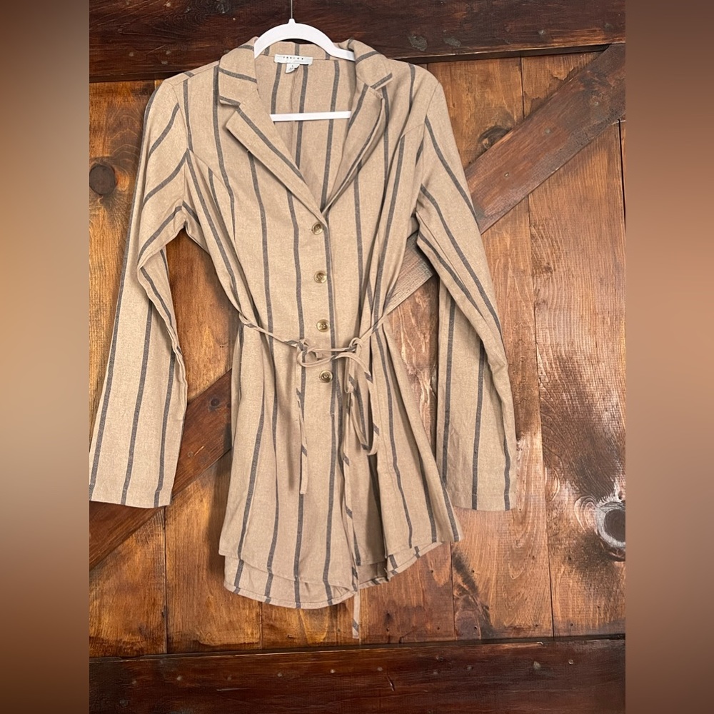 This is an adorable romper. It fits true to size & the length is short on legs.
